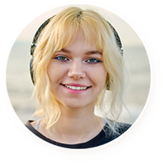 Young woman with blonde hair wearing headphones and smiling.
