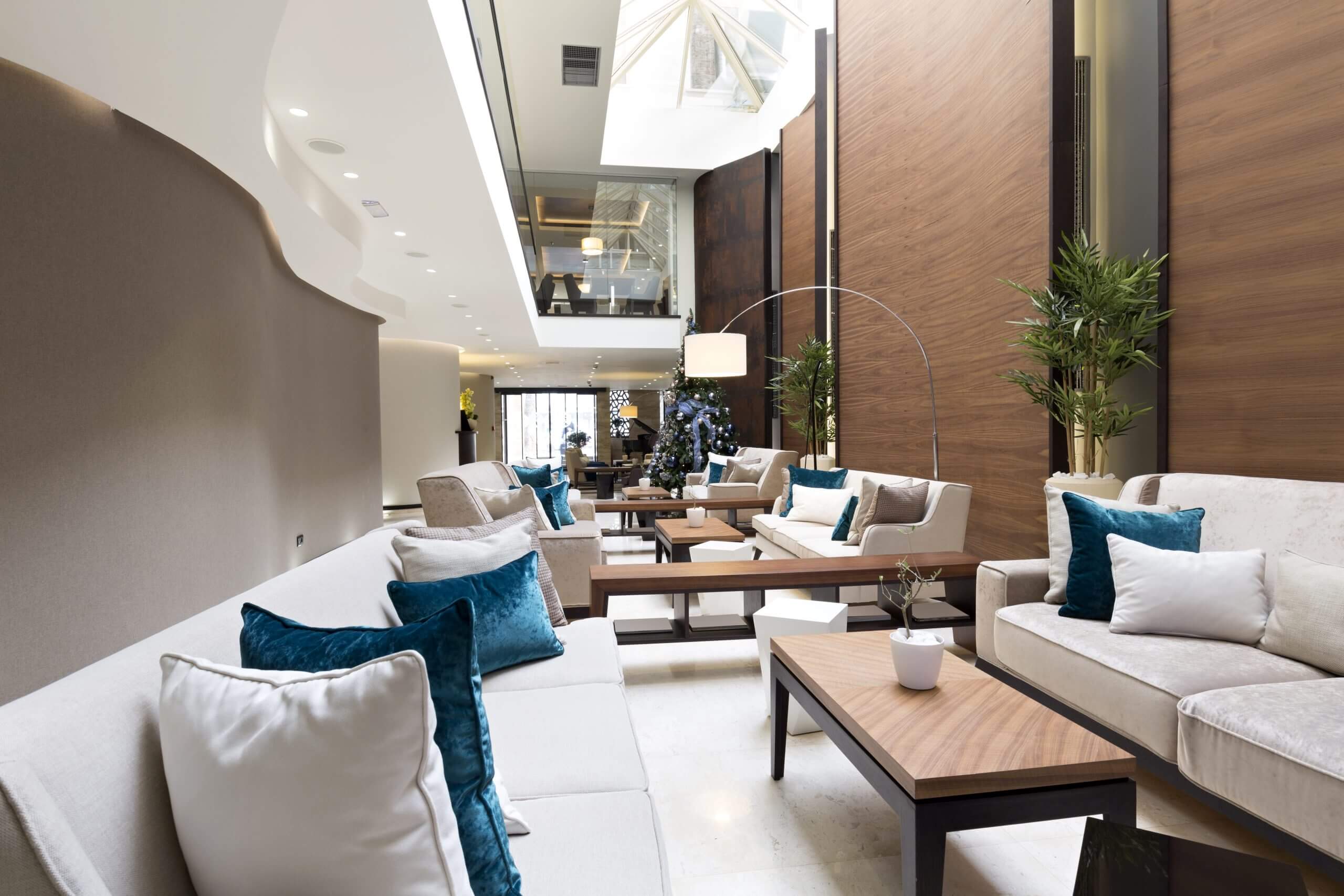Modern living room with high ceilings and cozy seating.