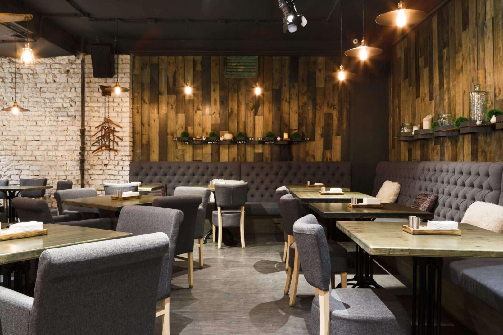 Cozy rustic restaurant interior with tufted seating